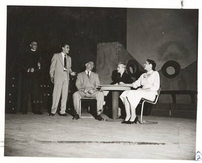 Performers from l-r: Guy Terwilleger as Rev. William Duke, Kenneth Goldsberry as Mr. Prior, Morton Grinker as Mr. Lingley, Larraine Cole as Mrs. Midget, Shirley Banning as Mrs. Cleveden Banks. The characters laugh at a table in Idaho drama's production of 'Outward Bound.' Presented by the University Players, an ASUI production directed by Jean Collette.