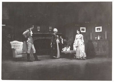 Performers from l-r: Jack Muller as Hastings, Virginia Keeton as Mrs. Hardcastle, Barbara Leach as Miss Nevills and Dennis Savage as Tony Lumpkin. Tony Lumpkin kneels and speaks to Mrs. Hardcastle in Idaho drama's production of 'She Stoops to Conquer.' An ASUI production directed by Jean Collette in the University Auditorium.