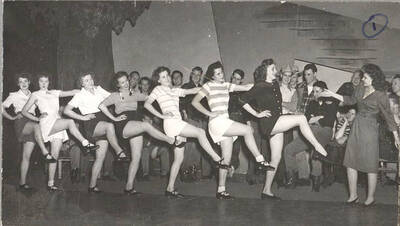 Idaho drama students rehearse the chorus-line dance for the upcoming production of 'Sing, Singleton, Sing.' An ASUI production written by Geoffrey Coope, Theodore Sherman, & music Hall Macklin (all UI teaching faculty), directed by Jean Collette in the University Auditorium.