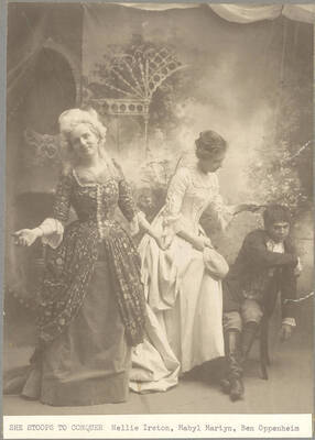 Mabyl Martin acts as Constance Neville and tries to comb the hair of Tony Lumpkin, played by Ben Oppenheim, while Mrs. Hardcastle, played by Nellie Ireton stands smiling in the University of Idaho's production of "She Stoops to Conquer." Presented by the University of Idaho Dramatic Club and directed by Aurelia Henry.