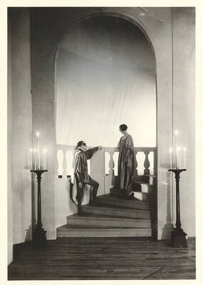 Kneeland Parker, as Romeo, talks to Marie Gauer, as Juliet, on the stairwell during the ball scene of Idaho drama's production of "Romeo and Juliet." Adapted by Talbot Jennings, directed by John Cushman in the University Auditorium.