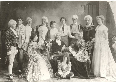 Students from left to right, standing: Ben Oppenheim, John McConnell, Andrew Peterson, Homer David, Nellie Ireton, Aurelia Henry, William Lee, B.L. French, Mable Martyn; seated: Edna Moore, Fred McConnell, Anna Edna Clayton; floor: Alfred Foster. Idaho drama students pose in costume for the school's production of "The Rivals."  Directed by Aurelia Henry.