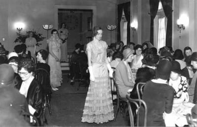 A room full of guests and models at the Hays Hall fashion tea.