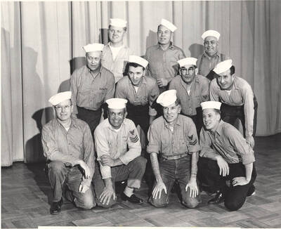 Students pictured: Top: Dave Lange, Eldred Thomas, Curt Talbott; middle: Don Corless, Gary Whitmore, William Marineau, Martin Huff; bottom: John McMullen, John Brown, Robert Hosack, Win Cook. The sailor chorus poses for a photograph prior to Idaho drama's production of "South Pacific." Directed by Ed Chavez in the Moscow High School Auditorium.