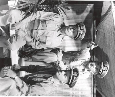 George Woodbury and Gale Mix, Jr. pose as military men in Idaho drama's production of "South Pacific." Directed by Ed Chavez in the Moscow High School Auditorium.