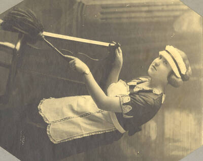 A photograph of the fifth act of 'Her Money Man' by the University of Idaho's drama department. A touring show directed by John Cushman. Presented by the Varsity Players and also staged in the University Auditorium.