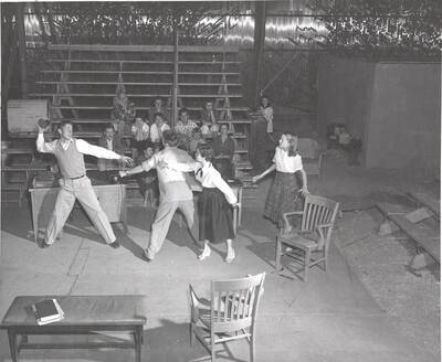 Idaho drama students rehearse a scene of "Time Out for Ginger" prior to the play's production. Summer Theatre in the Field House and directed by Howard Dorgan.