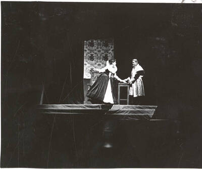 Karen Hurdstrom and Paul Matthews perform a scene during Idaho drama's production of "Mary of Scotland." ASUI Dramatics production directed by Jean Collette in the University Auditorium.