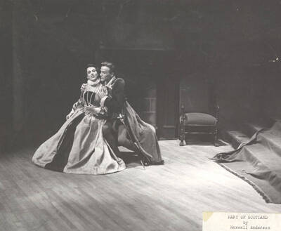 J. Madison holds Janet Biker from behind in Idaho drama's production of "Mary of Scotland." ASUI Dramatics production directed by Jean Collette in the University Auditorium.