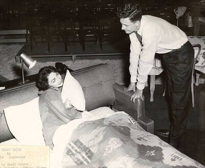 Jane Sauer and Richard Roberge perform together on stage during a drama production of 'Grand Prize'. Summer Theatre in the Field House directed by Cecil Matson.