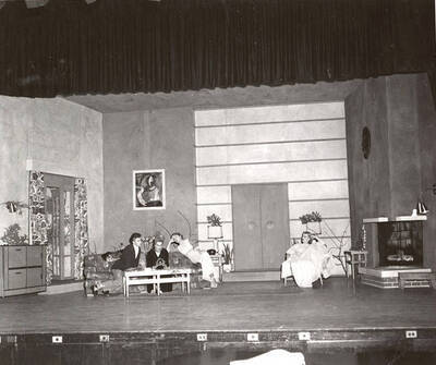 Gary Leaverton, Shirley Lent, Sharon Henderson, Lea Jensen perform a group scene during a drama production of 'Blithe Spirit'. An ASUI production directed by Jean Collette.