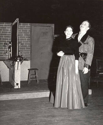 Joan Fischer and Lawrence Black on stage during a drama production of 'Kiss Me Kate'. ASUI productions directed by Jean Collette in the University Auditorium.