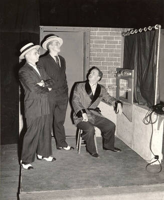 Nathan Yost, Clifford Cook and Lawrence Black performing a scene together during a drama production of 'Kiss Me Kate'. ASUI productions directed by Jean Collette in the University Auditorium.