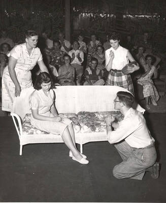 Shirley Lent, Toni Botsford, Connie Brookins and Andy Tozier perform together on stage during a drama production of 'Charity Begins'. Summer Theatre in the Field House directed by Jean Collette.