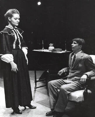 Dick Weholt on the right looking at a woman standing in front of him. Summer Theatre in the Field House directed by Donald Hill.