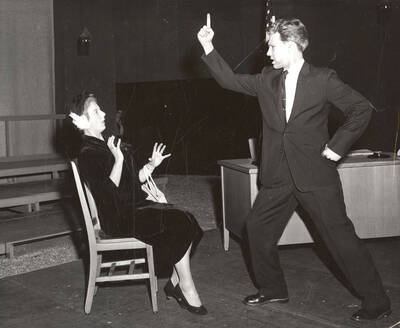 Rita Larson startled by Marvin Alexander. Summer Theatre in the Field House directed by Jean Collette.