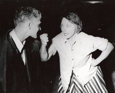 Andrew Tozier and Maybelle Clinkosky. The woman holding her fist up at the man. Summer Theatre in the Field House directed by Cecil Matson.