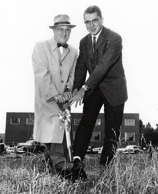 University of Idaho President Donald Theophilus and ASUI President Richard James Mullen break ground on the third addition to Student Union Building.