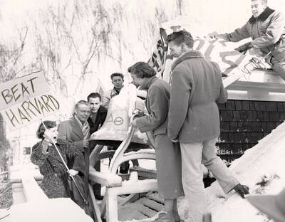 The Committee gathers outside in the snow during the 'Beat Harvard' rally during Red Cross Blood Drive.