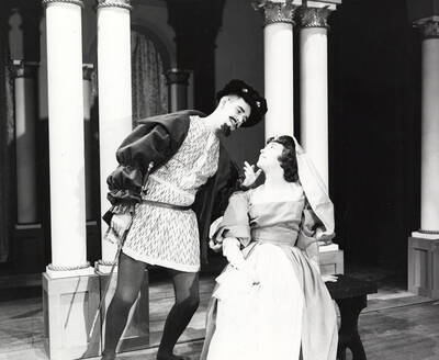 Roger Barr as Corvina propositioning Diane Fawson as Celia in drama production of "Volpone." ASUI production directed by Jean Collette.