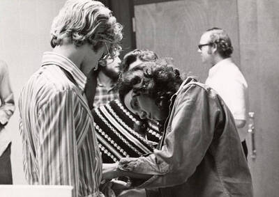 Paul Gussenhoven being measured for costume during the drama production of "You're a Good Man, Charlie Brown." Cast: Val Molkenbuhr as Charlie Brown, Jim Hutcherson as Linus, Ed Britt as Schroeder, Joan Gardner as Lucy, Deborah Magee as Patty and Paul Gussenhoven as Snoopy. Summer Theatre directed by Edmund Chavez in the Kiva.