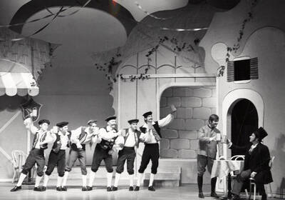Men stand onstage and raise their mugs in the air during "The Bartered Bride."  Presented by Music and Drama department, directed by Forrest Sears. Music director Charlie Walton. Staged in the University Auditorium.