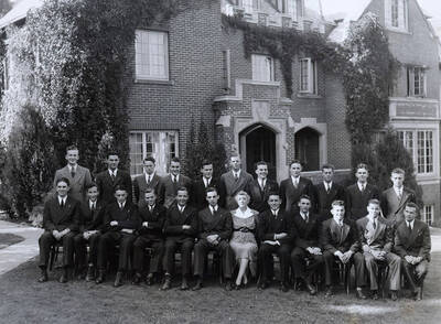 Group picture outside the Beta Theta Phi house, located on the northwest corner of Idaho and Elm Streets.