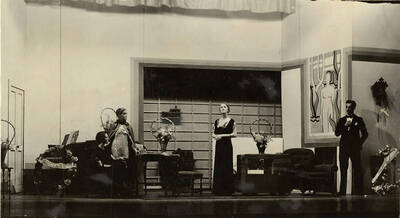 Scene from the University of Idaho drama production of "Torch Bearers." Directed by Fred Blanchard, Technical Director Theodore Prichard. Members of the cast include Catherine Brandt as Mrs. J. Duro Pampinelli, Grace Eldridge as Mrs. Nelly Fell, Marthalene Tanner as Mrs. Paula Ritter and Leland Cannon as Fred Ritter.