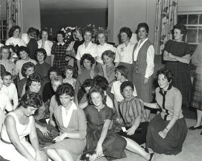 Part of a group photograph of Delta Gamma women preparing for a formal portrait after Squeal Day.