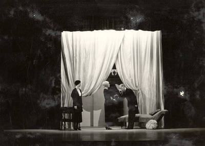 Scene from the University of Idaho drama production of "The Living Corpse." Directed by Fred Blanchard, Technical Director Theodore Prichard. Cast members include Fred C. Blanchard as Fedya, Ethlyn O'Neal as Lisa, Clayne Robison as Victor, Alberta Bergh Utt as Masha, Raphael Gibbs as Prince Sergius, Erma Lewis as Anna Pavlovna, Casady Taylor as Petrovitch, Earl Bopp as Artimiev, and Joe Paquet as Petushkov.