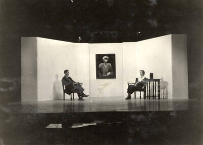 Scene from the University of Idaho drama production of "The Living Corpse." Directed by Fred Blanchard, Technical Director Theodore Prichard. Cast members include Fred C. Blanchard as Fedya, Ethlyn O'Neal as Lisa, Clayne Robison as Victor, Alberta Bergh Utt as Masha, Raphael Gibbs as Prince Sergius, Erma Lewis as Anna Pavlovna, Casady Taylor as Petrovitch, Earl Bopp as Artimiev, and Joe Paquet as Petushkov.