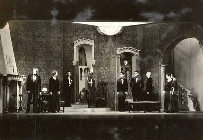 Scene from the University of Idaho drama production of "Death Takes a Holiday." ASUI production directed by Fred Blanchard. Members of the cast include Lionel Campbell as Prince Sirki, Bertha Moore as Grazia, Clayne Robison as Duke Lambert, Winfred Janssen as Eric Fenton, Howard Altnow as Corrado, Raphael Gibbs as Baron Cesarea, and Casady Taylor as Major Whitred.