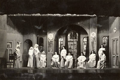 Group scene from the University of Idaho drama production of "The Cradle Song." Directed and designed by Edmund Chavez. Members of the cast include Bertha Moore as Sister Joanna of the Cross, Margaret Moulton as Teresa, Kathryn Hart Conger, Grace Eldridge, Lucille Moore, Betty Brown, Dorothy Menzies, Naomi Randall, Elinor Jacobs, Alberta Bergh, Elizabeth Loomis, and Lillian Sorenson.