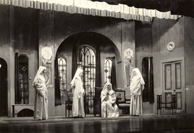 Group scene from the University of Idaho drama production of "The Cradle Song." Directed and designed by Edmund Chavez. Members of the cast include Bertha Moore as Sister Joanna of the Cross, Margaret Moulton as Teresa, Kathryn Hart Conger, Grace Eldridge, Lucille Moore, Betty Brown, Dorothy Menzies, Naomi Randall, Elinor Jacobs, Alberta Bergh, Elizabeth Loomis, and Lillian Sorenson.