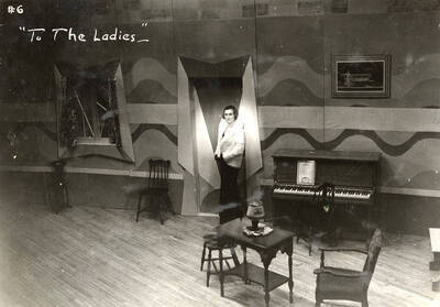 Scene from the University of Idaho drama production of "To The Ladies." Directed by Fred Blanchard. Members of the cast include John Thomas as Leonard Beebe, Catherine Brandt as Elsie Beebe, Elinor Jacobs as Mrs. Kincaid, Harry Robb as John Kincaid, Howard Altnow, John Milner, Casady Taylor, Rollin Hunter, Franklyn Bovey, Winfred Janssen, Walter Pratt, and Edwin Ostroot.