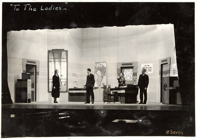 Scene from the University of Idaho drama production of "To The Ladies." Directed by Fred Blanchard. Members of the cast include John Thomas as Leonard Beebe, Catherine Brandt as Elsie Beebe, Elinor Jacobs as Mrs. Kincaid, Harry Robb as John Kincaid, Howard Altnow, John Milner, Casady Taylor, Rollin Hunter, Franklyn Bovey, Winfred Janssen, Walter Pratt, and Edwin Ostroot.