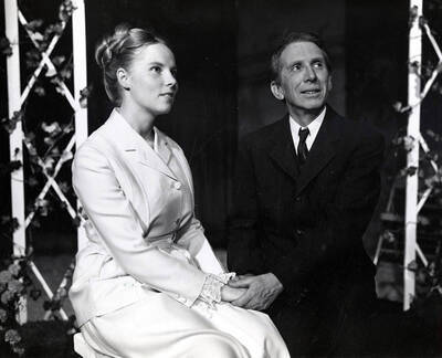 The University of Idaho drama production of "Little Mary Sunshine." Directed by Edmund Chavez for Summer Theatre in the Field House. Bill Byrd (right) can be seen sitting with a woman and holding her hands.