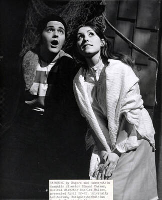 Scene from the University of Idaho drama production of "Carousel." A man and a woman can be seen looking off into the distance. Directed by Edmund Chavez, music director Charles Walton, dance choreography by Diane Walker in the University Auditorium.