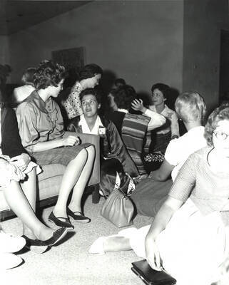 Current members of Gamma Phi Beta sit and talk with interested girls in Gamma Phi Beta's living area during rush week.