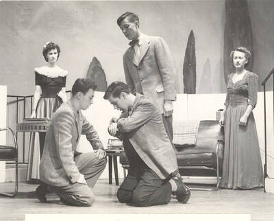 The University of Idaho drama production of "Hotel Universe." Ann Smith as Hope Ames, Jack Rowe as Patrick Farley, Orvid Ray Cutler, Jr. as Tom Ames, Louis Casho as Norman Rose, Drexel Brown as Ann Field. Directed and designed by Jean Collette in the University Auditorium.