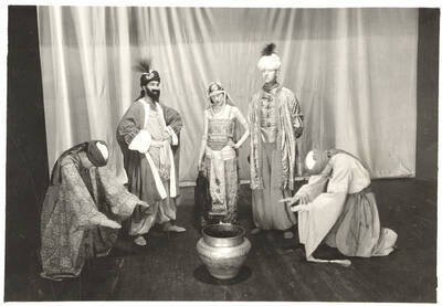 The University of Idaho drama production of "If." An all-university play by the Varsity Players, "If" toured the area and performed at the University Auditorium. Directed by John Cushman.