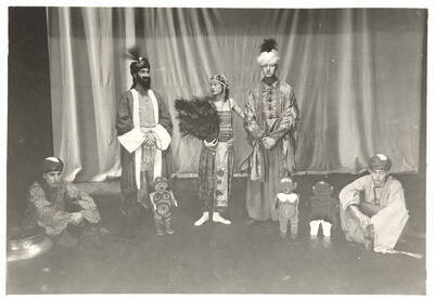 The University of Idaho drama production of "If." An all-university play by the Varsity Players, "If" toured the area and performed at the University Auditorium. Directed by John Cushman.