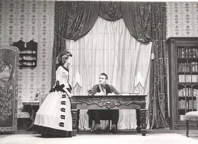 Marion Wilson as Caroline Branson and Otis Walter as Charles Dickens in the ASUI production of "The Romantic Mr. Dickens." Directed and designed by Jean Collette, art advisor Marion Featherstone in the University Auditorium.