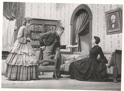 Betty Echternach as Miss Georgina Hogarth, Otis Walker as Charles Dickens and Barbara Smith as Mrs. Charles Dickens in the ASUI production of "The Romantic Mr. Dickens."  Directed and designed by Jean Collette, art advisor Marion Featherstone in the University Auditorium.