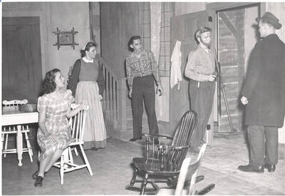 The ASUI production of "Papa Is All." Individuals identified from left to right: Marion Wilson as Emma, Grace Lillard as Mama, Edward Dalva as Jake, William Davidson as Papa, Mike Oswald as State Trooper. Directed and designed by Jean Collette in the University Auditorium.