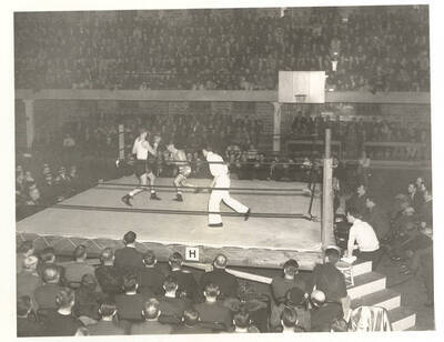 Idaho's Ralph Miller and San Jose State's Wren go toe-to-toe in a packed-house Memorial Gymnasium.