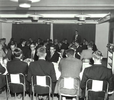 Current and hopeful members of Phi Delta Theta sit for coffee during Phi Delta Theta's rush week.