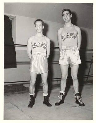 Idaho boxers Jack Gray and Jim Dreiver smile and pose for individual team photographs.