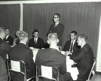 Potential Phi Delta Theta fraternity pledges listen to a current member of Phi Delta Theta speak during rush week.