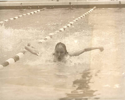 An unnamed swimmer uses the butterfly technique during the AIAW National Championships in Idaho's Swim Center.